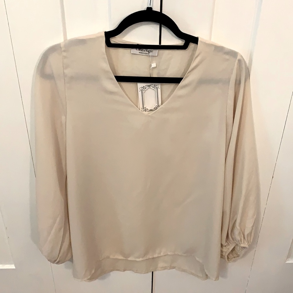 Ivory blouse. Long flounce sleeve. large